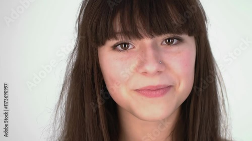 Friendly Young Woman Posing for Casual Studio Portraits