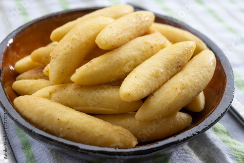 Schupfnudel or Fingernudel, finger noodle, dumpling or thick noodle in German and Austrian cuisine, similar to Central European kopytka and Italian gnocchi photo