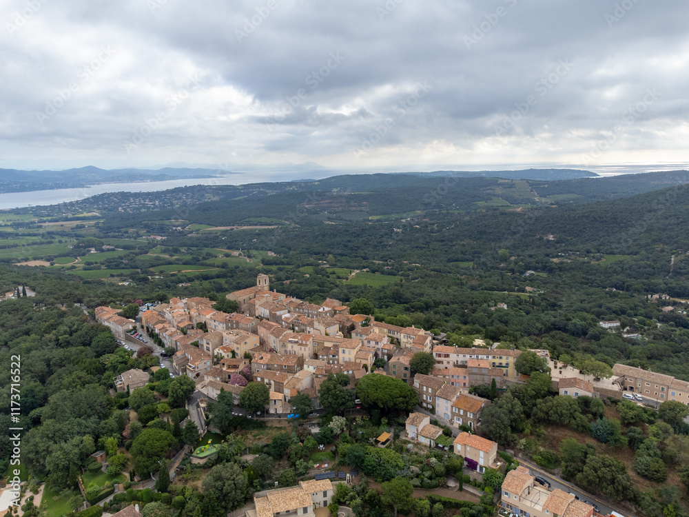 Fototapeta premium Aerial view on green hills, houses, gulf of saint-tropez, Gassin village, vineyards, Provence, Var, France