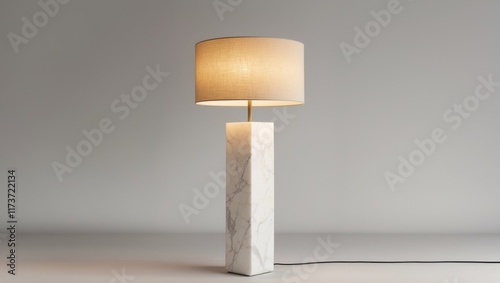 Modern floor lamp with a marble base and fabric shade photo