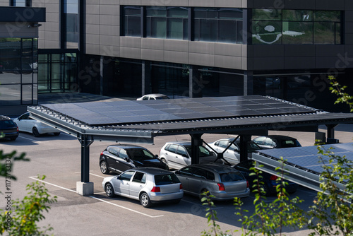 Fototapeta Naklejka Na Ścianę i Meble -  Parking space with solar panels on a roof