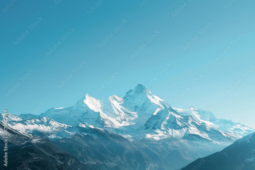 Obraz premium Pristine Snow-Capped Mountains Against a Brilliant Blue Sky