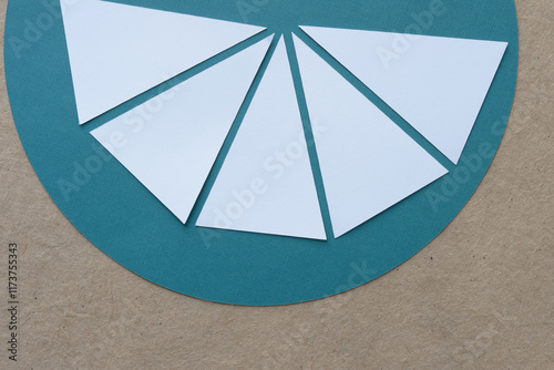 white paper isosceles triangles arranged on geometric forms 