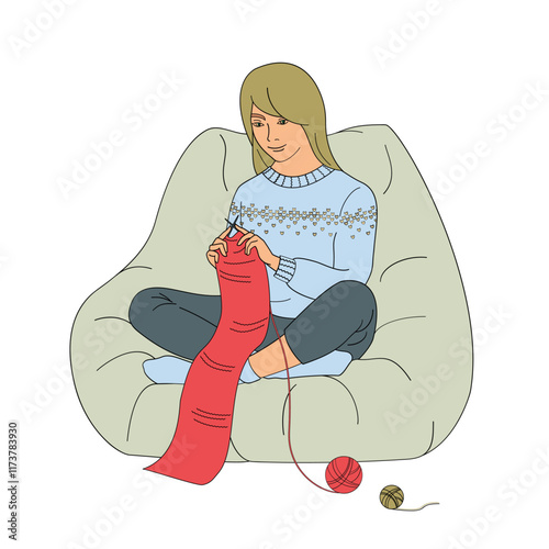 woman sits in a chair and knits a red scarf