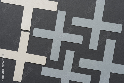 machine-cut geometric cross shapes on a relatively flat surface