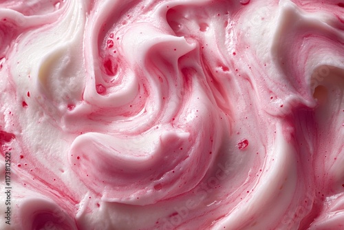 Soft pink whipped cream with red fruit swirl photo