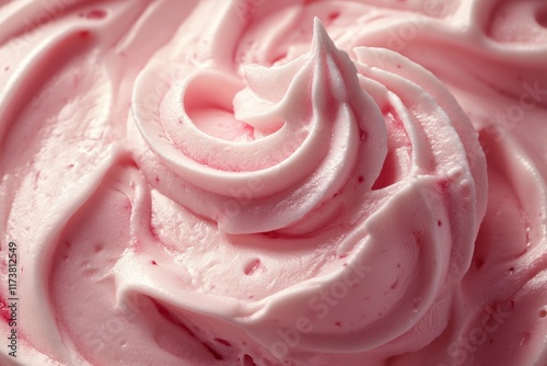 Whipped pink cream with vibrant red fruit swirl photo