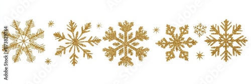 Set of gold glitter snowflakes isolated on a white background, cut out photo