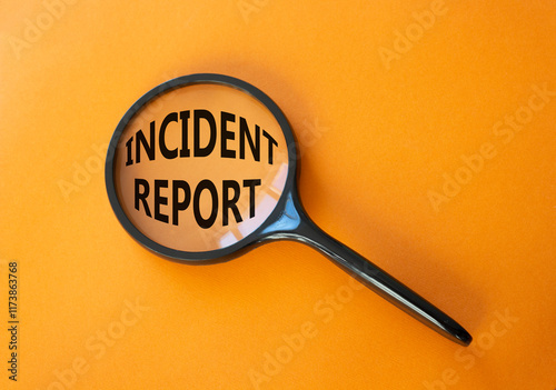 Incident Report symbol. Concept word Incident Report on magnifying glass. Beautiful orange background. Business and Incident Report concept. Copy space