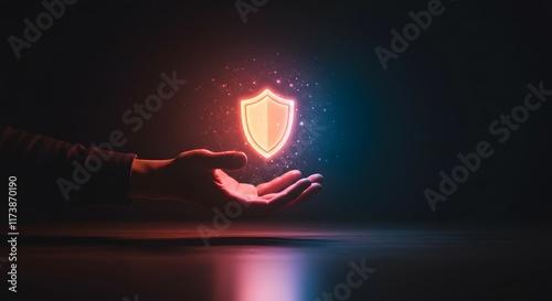 Hand holding glowing red shield symbol for enhanced cybersecurity defense and modern digital security technology against cyber threats in abstract futuristic style