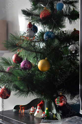 family decorating christmas tree
