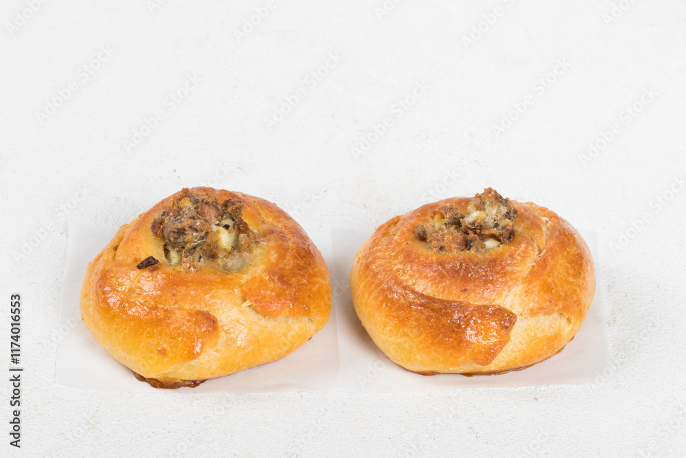 Two Small Open pie filled with fish, eggs and onions. White background. Close up Two Small Open pie filled with fish, eggs and onions. White background. Close up