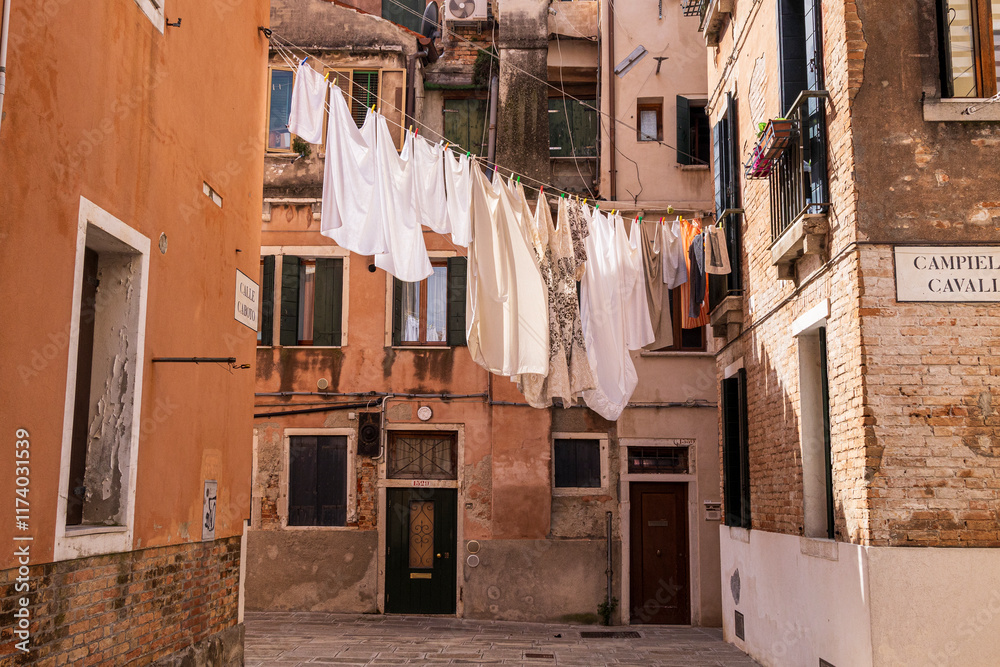 Italy, Venice. Arsenale neighborhood, Castello district. Laundry hanging to dry between buildings.