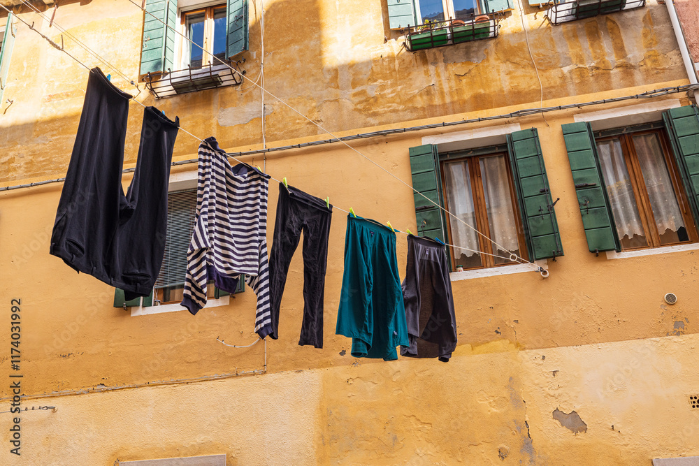 Italy, Venice. Arsenale neighborhood, Castello district. Laundry hanging to dry between buildings.