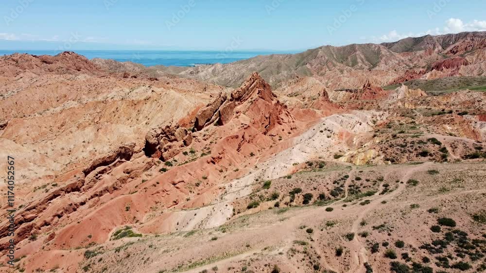 Aerial drone shot of Fairy Tale Canyon and Lake Issyk-Kul in eastern Kyrgyzstan. Aerial drone shot of Fairy Tale Canyon and Lake Issyk-Kul in eastern Kyrgyzstan.