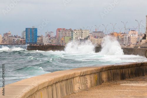 Cuba, Havana. Looking down the malecon during a storm with high, breaking waves. 2016-04-03 photo