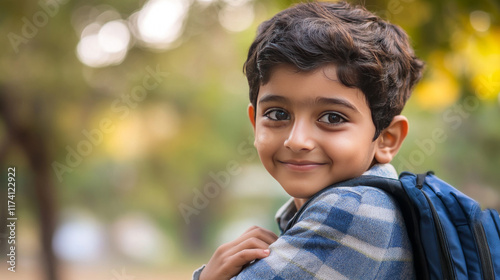 indin kid nurturing empathy in front of school building photo