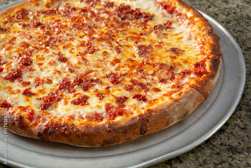 A view of a ground pepperoni pizza. A view of a ground pepperoni pizza.