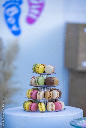 Beautiful macaron cake patisserie multi tier stand full of multi color macarons all flavors and assorted colors real wedding with flowers and roses pink strawberry in Gender Reveal Party