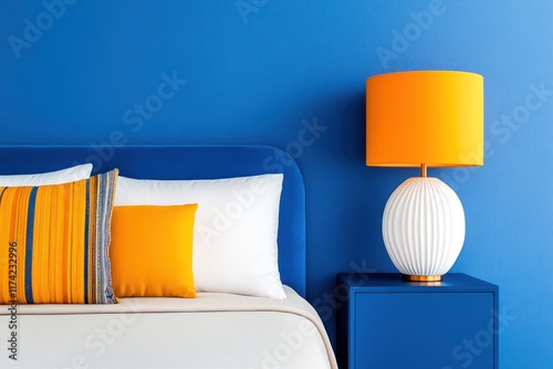 Eclectic Ethnic Bedroom with Blue Cabinet, Orange Lamp, and Multicolored Pillows on Beige Bedding