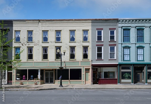 Fototapeta Naklejka Na Ścianę i Meble -  Small town main street 19th century buildings with stores on ground floor and apartments above