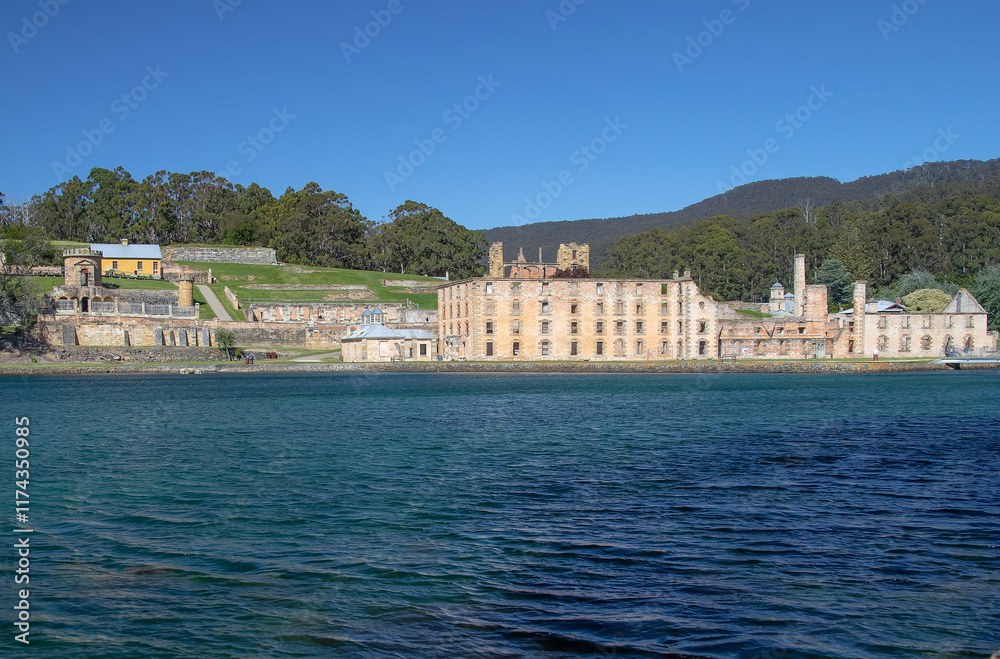 Historic ruins at Port Arthur Tasmania surrounded by lush greenery and calm waters under a clear blue sky. Australia Historic ruins at Port Arthur Tasmania surrounded by lush greenery and calm waters under a clear blue sky. Australia