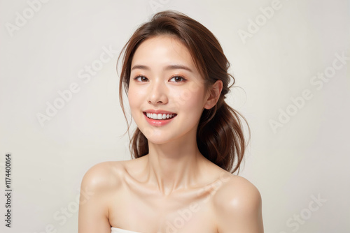 A woman with a beautiful smile and long brown hair