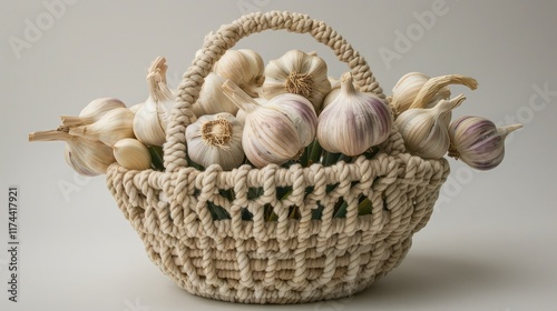 A unique garlic basket with a handcrafted, macrame design and a fragrant bunch of garlic photo