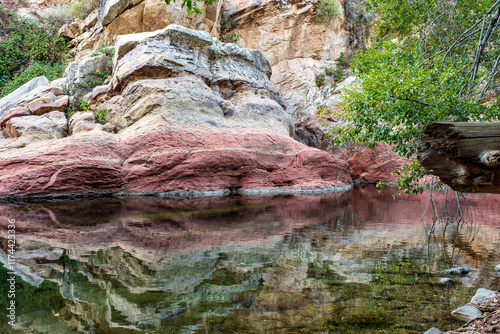Rock reflections on still water
