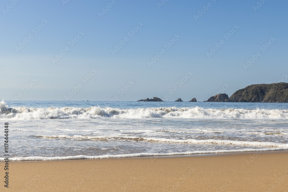 Panorama of the beach in Jalisco, Mexico with waves caused by the tide Panorama of the beach in Jalisco, Mexico with waves caused by the tide