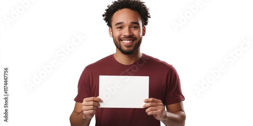 Happy young man holding blank white paper