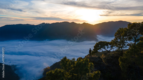 silhouette of a person in the mountains