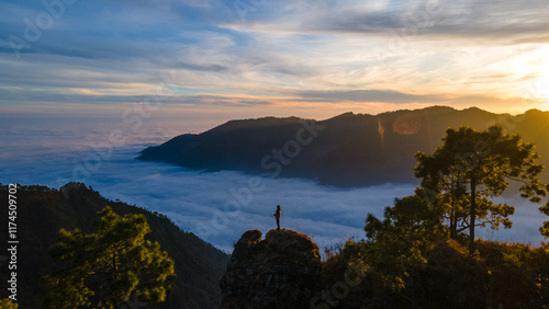 silhouette of a person in the mountains