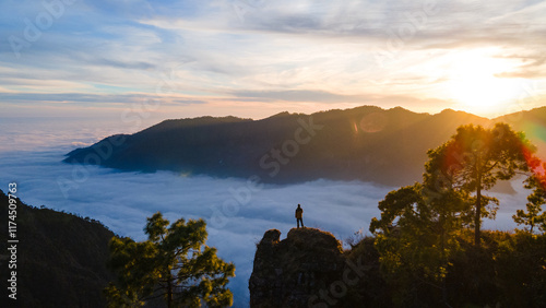 silhouette of a person in the mountains