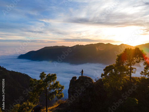 silhouette of a person in the mountains