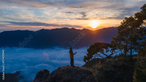 silhouette of a person in the mountains