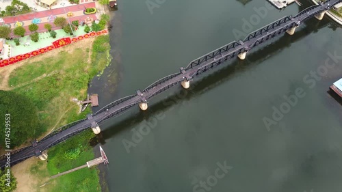 Aerial photograph (drone) of a train passing through the famous Death Railway in Kanchanaburi, Thailand