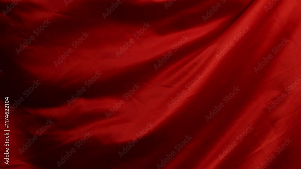 Red silk fabric moving in slow motion