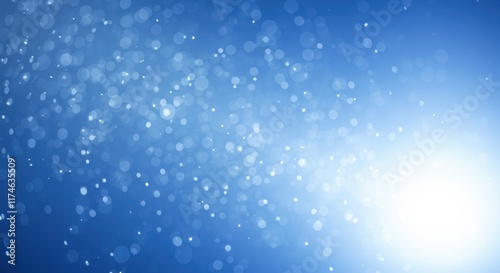 Dreamy blue bokeh with scattered glowing light circles
