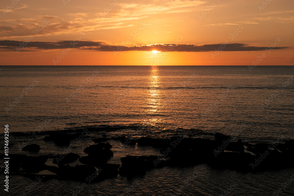 Sunset in the sea in orange tones, Sardinia Sunset in the sea in orange tones, Sardinia