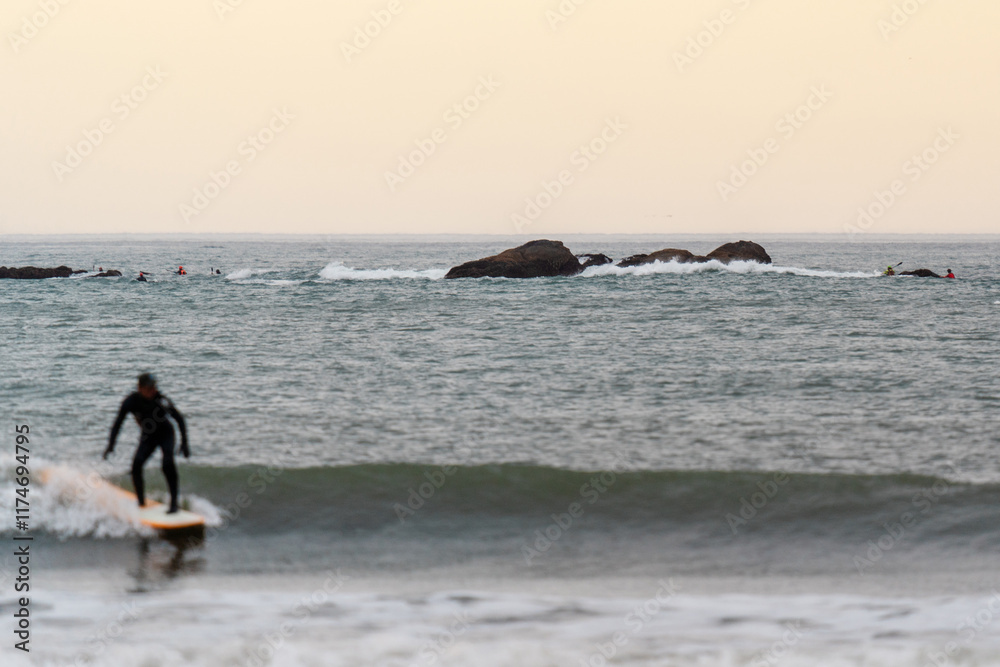Surfer at Hobuck Beach in the Olympic Peninsula on the far northwest corner of Washington Surfer at Hobuck Beach in the Olympic Peninsula on the far northwest corner of Washington