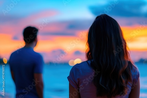 Sunset Silhouette: A Couple's Serene Evening by the Ocean