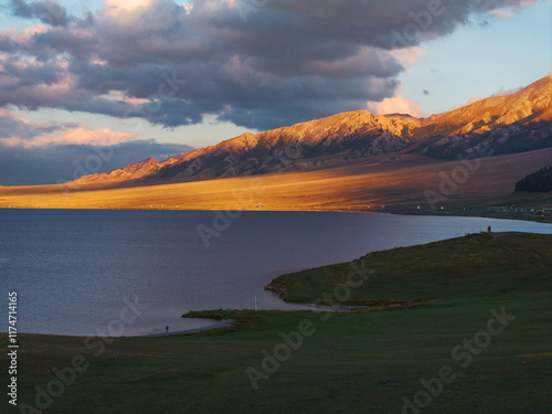 The beautiful scenery of Sayram Lake, coastal mountains, and grasslands in Xinjiang, China on September 4, 2024 photo