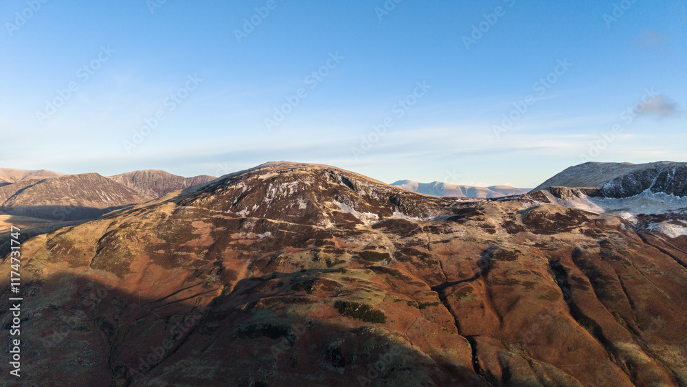 Dramatic aerial drone landscape in Autumn Winter of snowcapped mountains around Buttermere in Lake District at sunrise Dramatic aerial drone landscape in Autumn Winter of snowcapped mountains around Buttermere in Lake District at sunrise
