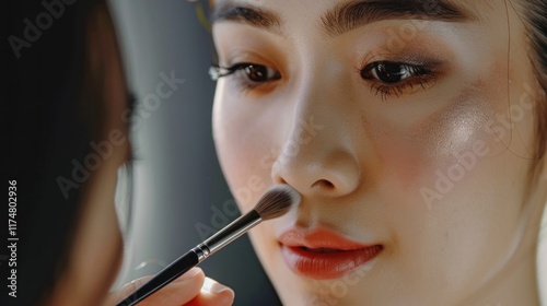 Makeup artist applies powder and blusher on beautiful Asian Woman Face, AI generated image