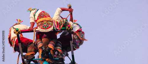 Authentic mexican dancers at Papantla, Veracruz performing the flying ritual dance, close-up. photo