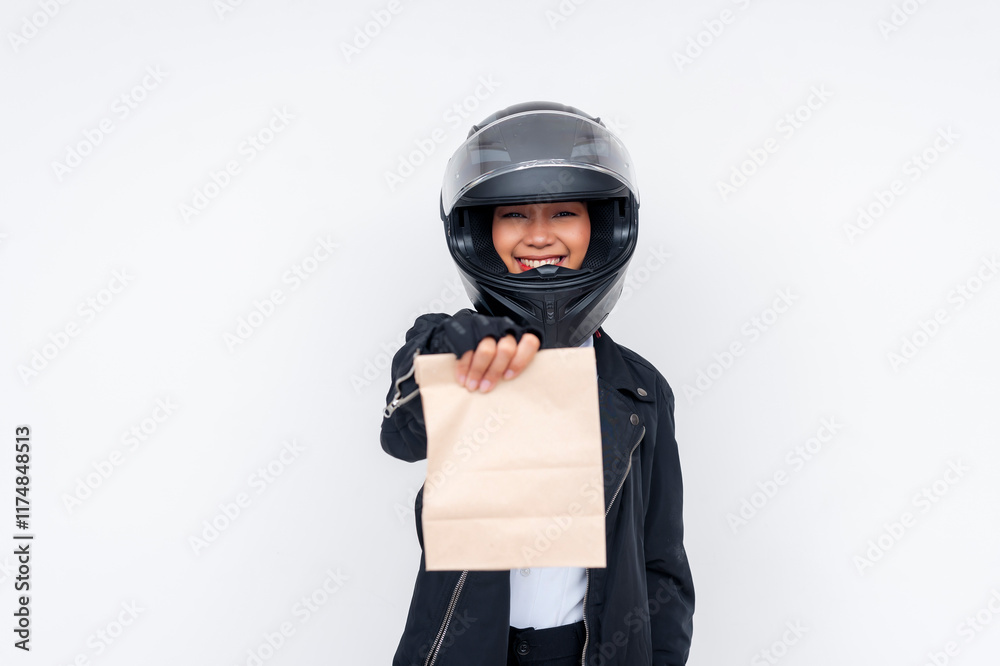 A friendly young Asian woman delivery rider delivering a takeout food order in a paper bag. Isolated on a white background. A friendly young Asian woman delivery rider delivering a takeout food order in a paper bag. Isolated on a white background.