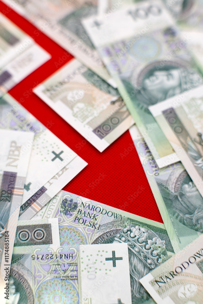 Fototapeta premium Graph of depreciation. Red graph, Polish cash banknotes, one hundred zloty. Economics and business. 