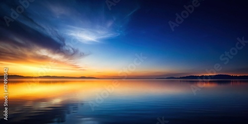 Serene Sunset Over Calm Water, Reflecting Vibrant Hues of Orange and Blue in a Tranquil Landscape
