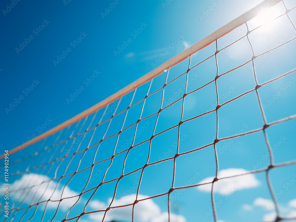 A tennis or volleyball net set against a clear blue sky on a sunny sports field A tennis or volleyball net set against a clear blue sky on a sunny sports field